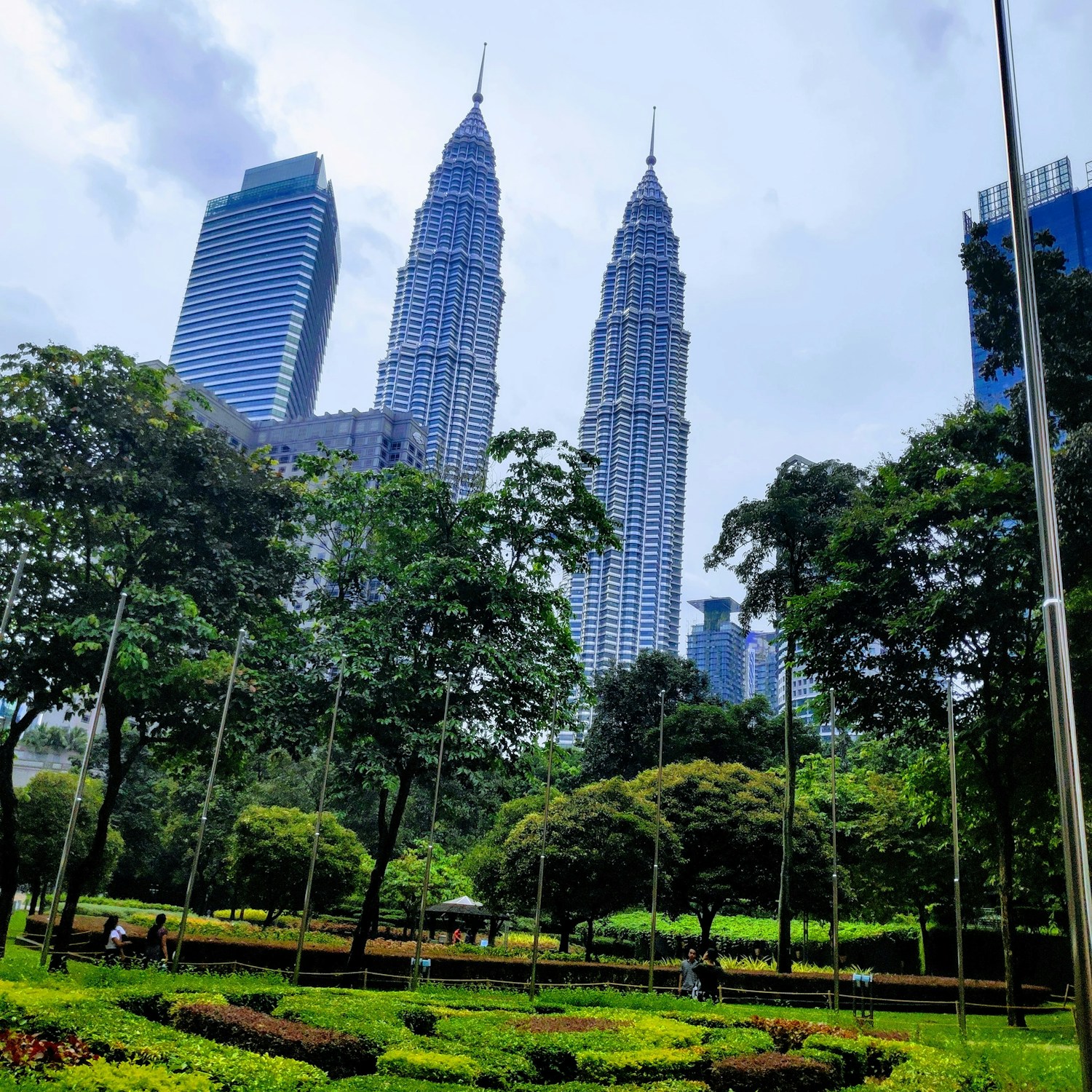 Petronas Twin Towers above the greenery of Kuala Lumpur